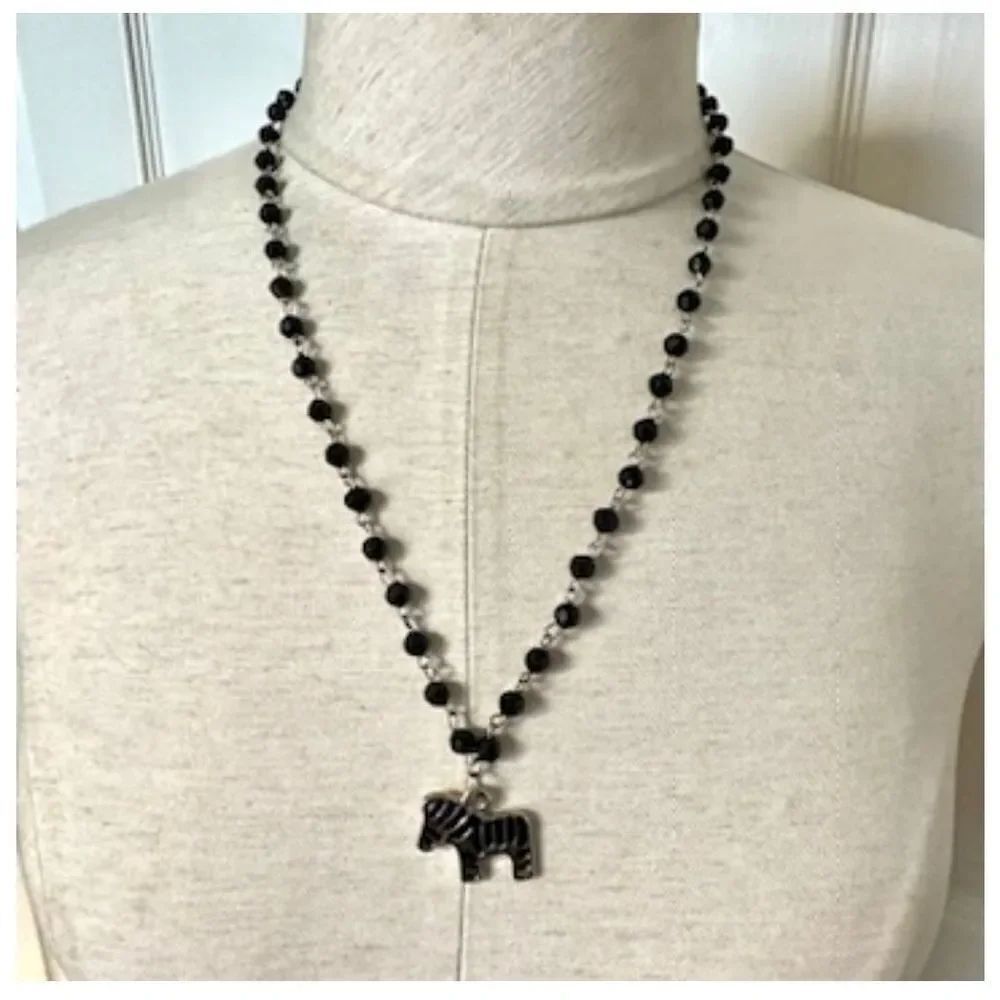 Silver tone black beaded zebra pendant necklace